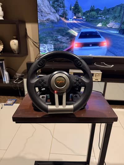 Xbox 360 with pxn stearing wheel with 60+games with 2 controllers