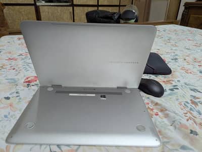 Hewlett-Packard HP Spectre Pro x360 G1 silver laptop.