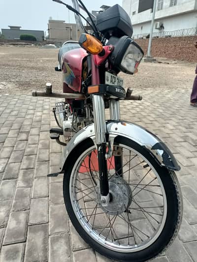 Honda CD-70 Red Color 2020 model, 2021 sticker.