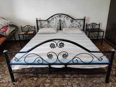 Iron bed with side tables