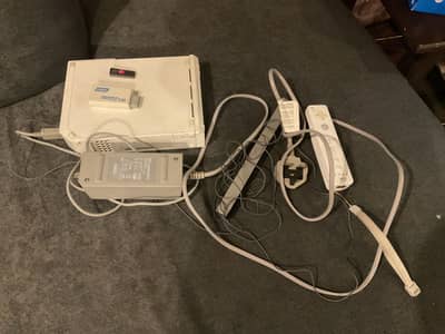 Nintendo Wii used console with games with nunchucks controller