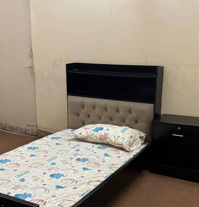 Single bed pair with side table