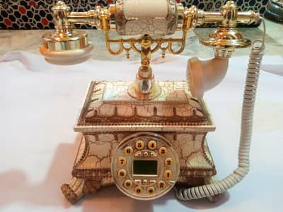 old is gold type telephone