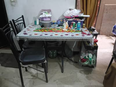 dining table double frame good condition with four chairs
