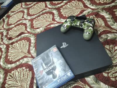 ps4 pro , 1 old controller, 1 box pack controller , and uncharted 4
