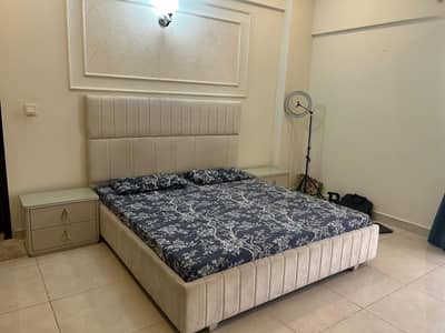 white bed set with dressing tables and with side tables