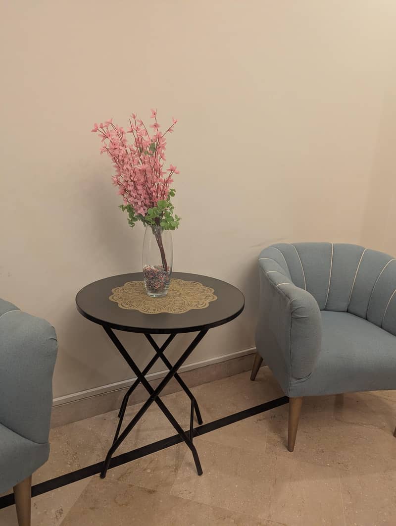 2 sofa chairs with table 1