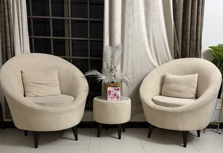 Two chairs including a side table