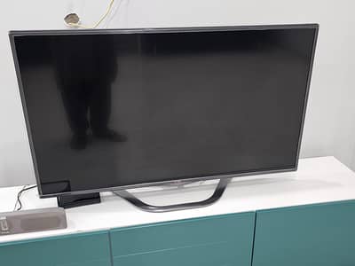 LG smart TV with Magic Remote + TV cabinet