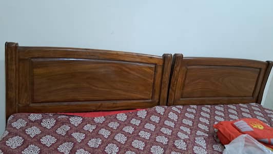 Two single beds with side tables