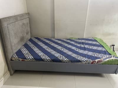 Single sized bed, sturdy and comfortable with foam mattress.