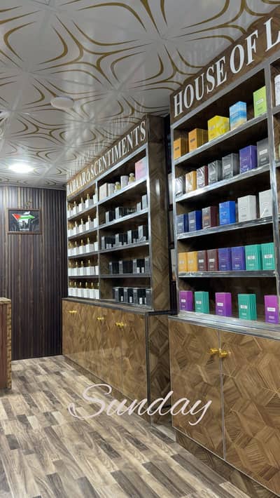 Shelves , racks , L shape counter . Was made for perfume shop/outlet