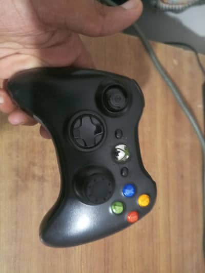 xbox 360 with one wireless controller and 30 games installed