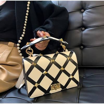 White & Black Studded Bag  Size : Medium Price : 4500 Rs