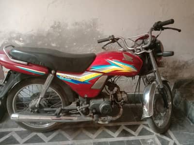 red Honda dream CD 70 bike