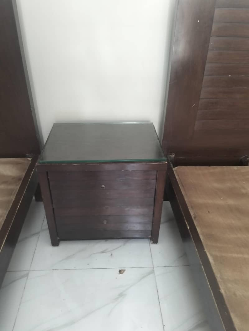 2 single beds with one side table 3