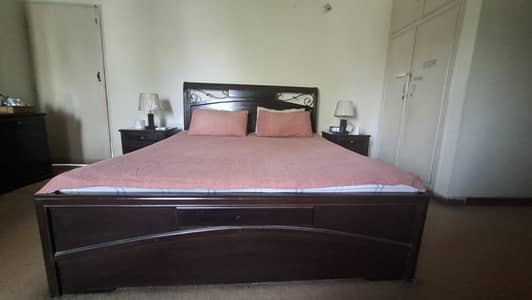King size bed with side tables and dressing table