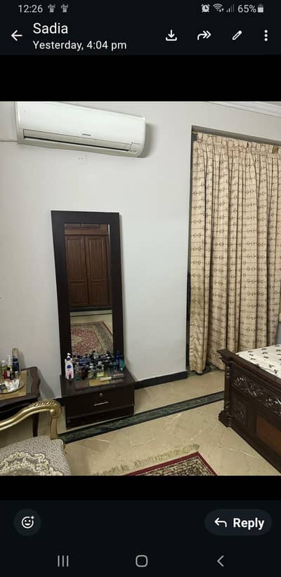 a looking glass is available  for sale with attached drawer
