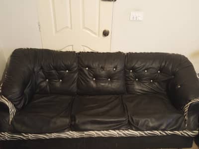 7 seater sofa set black and zebra colour leather.