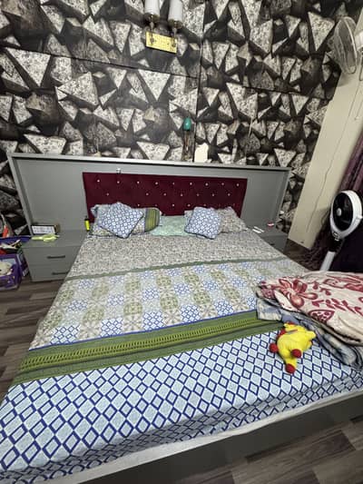 Bed with side tables and dressing table