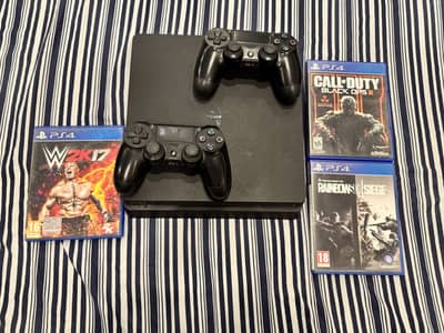 PS4 Slim 500gb with 2 controllers and 3 games