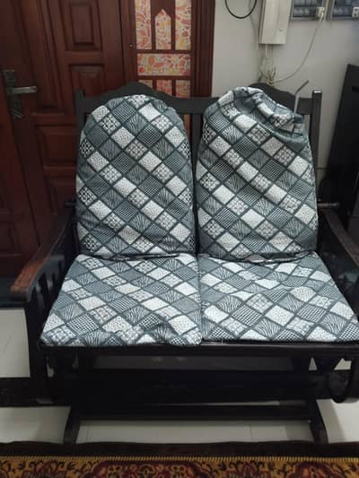 2 persons Swing Chair in good condition with good fabic cousins