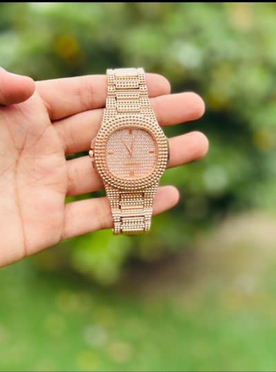 Rose gold textured chain watch with fold clasp
