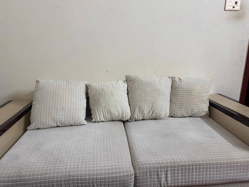 white colored comfortable sofa 0