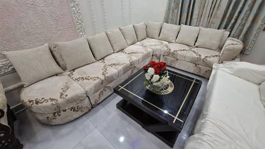 Beautiful L Shaped Sofa With A Center Table