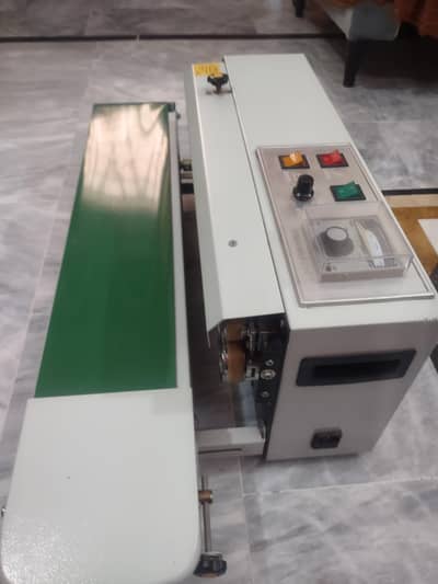 Continuous band sealer machine