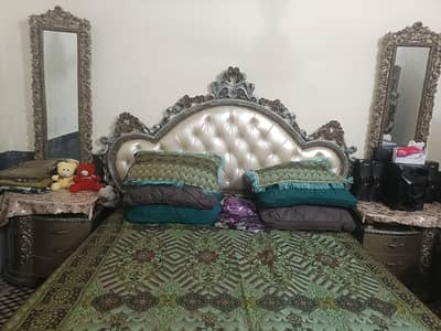 King size bed with long mirror side tables and large dresser