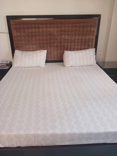 king size bed with mattress, side tables and dresser