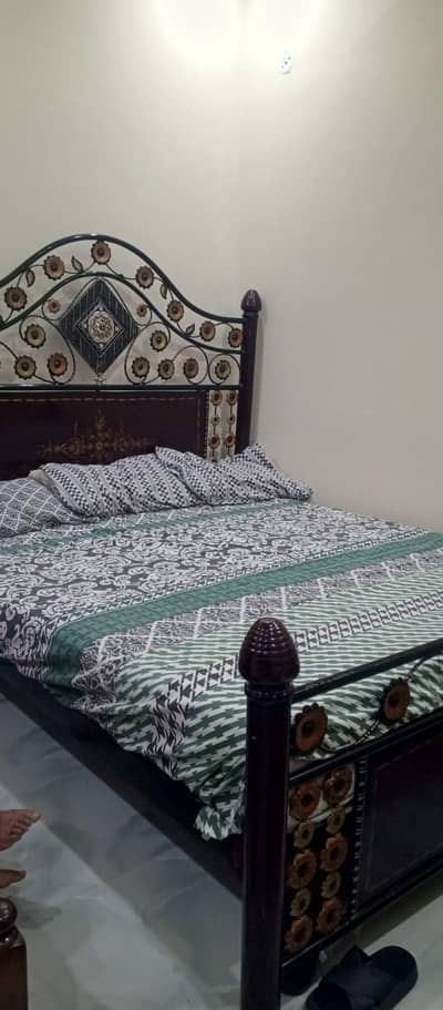 iron bed with mattress and side tables