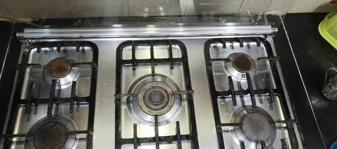 Care brand cooking range with five stove
