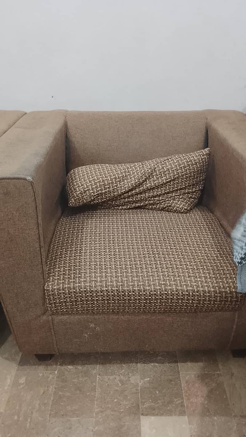 brown square shape sofas 1