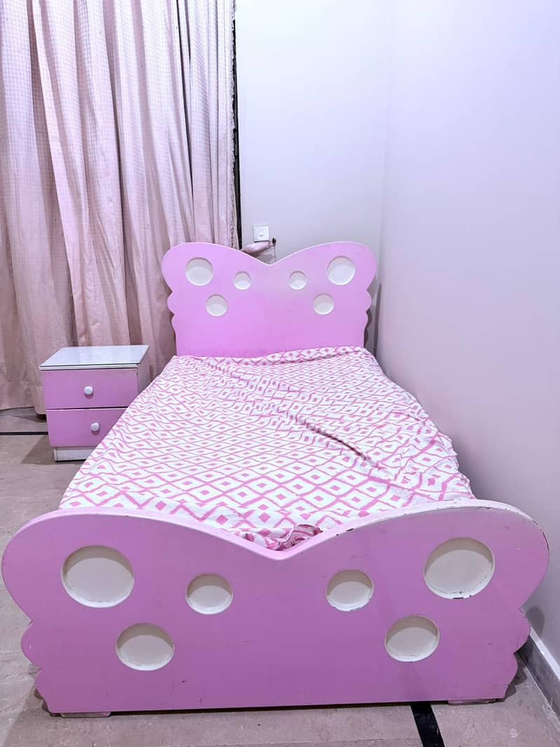 single bed and side table 0