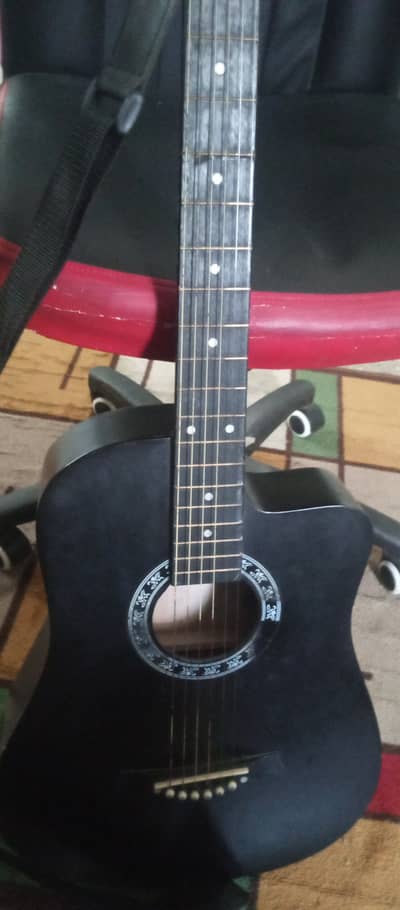 Acoustic guitar with trust rod