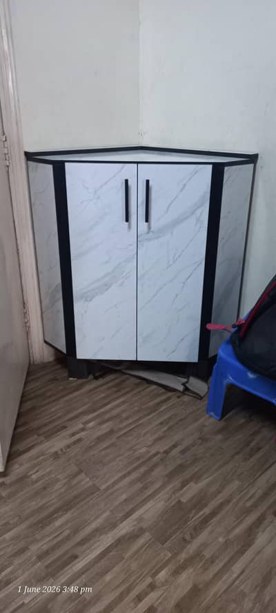 corner almari. almost new. best condition. 10/10 condition