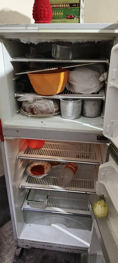 Dawlance refrigerator. . . medium size black and gray color