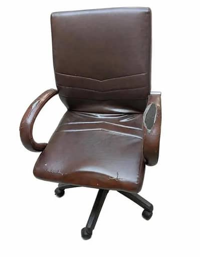 Brown Executive chair with minor damage.