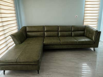 Green leatherette l shaped sofa