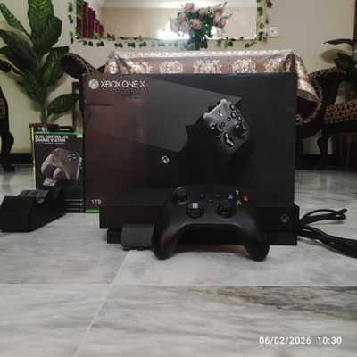 Xbox one x with packaging and dual controller charger