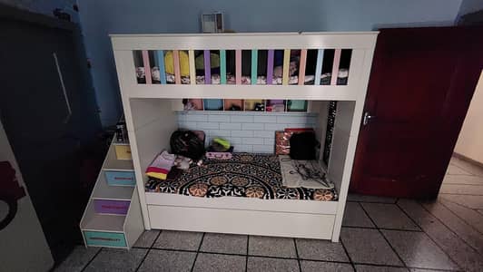 Bunk Bed with 3 Bed Space for Kids and Double Door Cupboard.