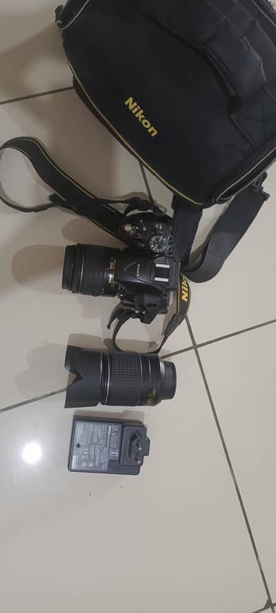 Nikon D5300 with two lenses 18 55mm and 55 200mm