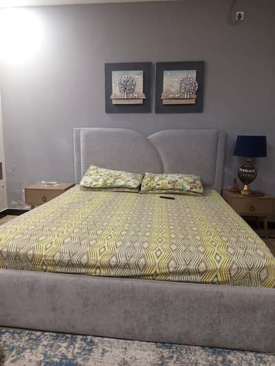 bed set with side tables and a floating dressing table