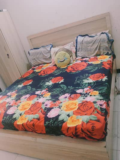 bed with 2 site tables tv trolly and dressing table