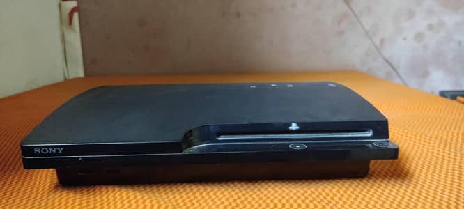 Playstation(PS3 Slim) with two original Controllers