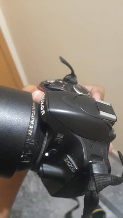 Nikkon D3200 with 50mm lens , 2 batteries and bag