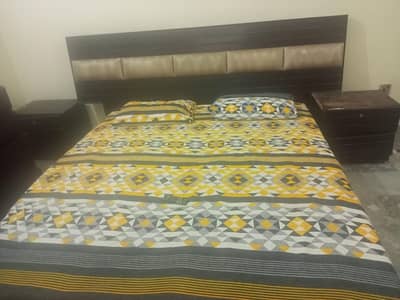 Bed with side tables and dressing table