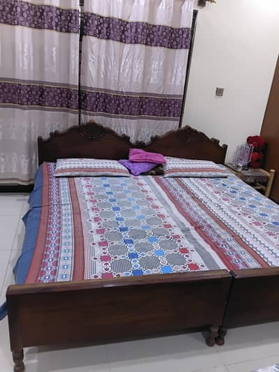 2 wooden bed